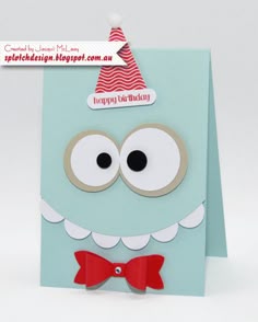 a close up of a greeting card with a face