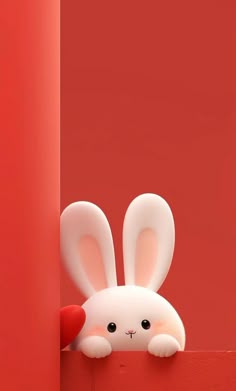 a stuffed rabbit is peeking out from behind a red wall