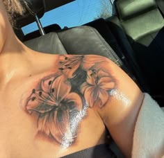 a woman's chest with flowers on it