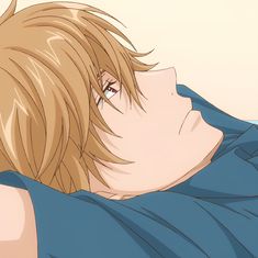 a man with blonde hair and blue shirt looking off into the distance while holding his arm over his shoulder