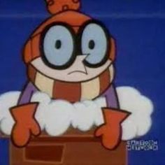 an animated character with big eyes and a hat on top of a box in front of a blue background