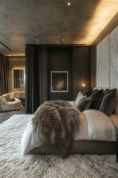 a large bed sitting in the middle of a living room next to a wall mounted tv