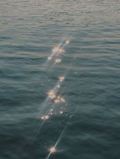 the sun shines brightly in the water as it reflects off the surface of the ocean