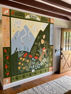 a large mural on the wall in a room with wood flooring and wooden doors