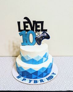 a birthday cake with a video game controller on top that reads level 10 happy birthday