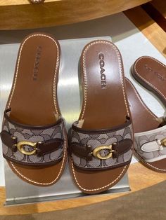 Coach Holly Slide Sandals monogram print in brown on brown gold detailing Trendy Shoes Sneakers, Pretty Sandals, Pretty Sneakers, Pretty Shoes Sneakers, Shoe Wishlist, Shoes Outfit Fashion, Fresh Shoes, Nike Schuhe, Hype Shoes