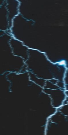 lightning strikes in the dark night sky
