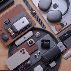 an assortment of cell phones and accessories laid out on a table