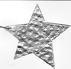 a silver star with white stars on it
