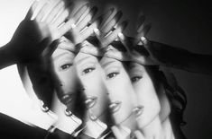 a group of women with their hands on top of each other's heads and hair combs in front of them