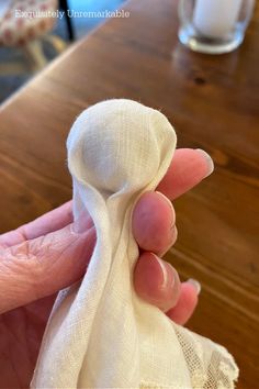 someone is holding a cloth napkin in their hand