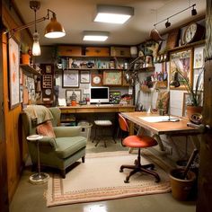 a home office with lots of clutter on the desk