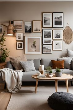 a living room filled with furniture and pictures on the wall above it's coffee table