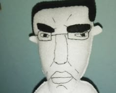 a close up of a stuffed animal with glasses