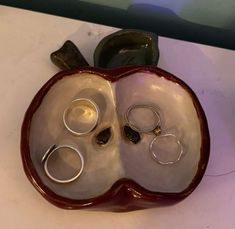 a couple of rings sitting on top of a bowl