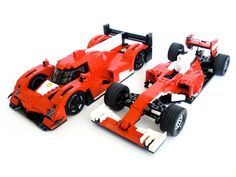 two red lego race cars sitting next to each other