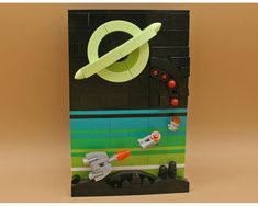 a bag made out of legos with an image of a space shuttle on it