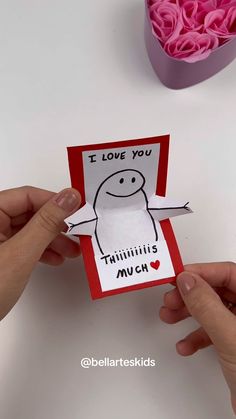 someone is holding up a card with the words i love you, thinlits much