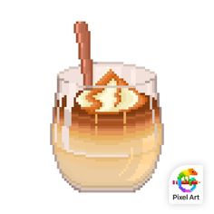 a glass filled with liquid sitting on top of a white table next to a wooden spoon