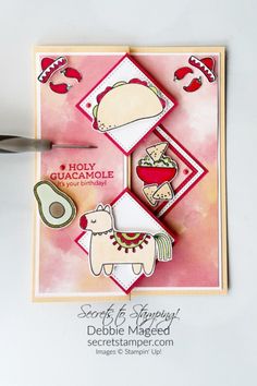 a close up of a card with scissors on the side and an object in the middle