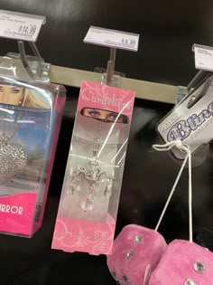 barbie dolls and jewelry are on display at the toy store for $ 3 99 each
