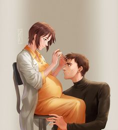 a man sitting next to a woman on top of a chair