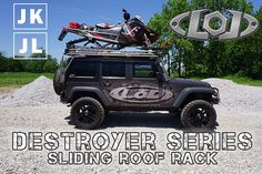 a jeep with skis on the roof rack