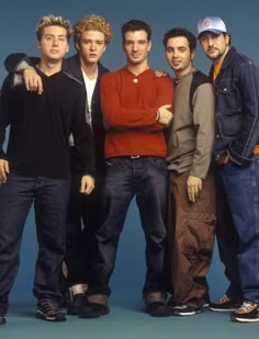four young men standing together with the words, they were both fans of nsync