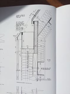 an open book with drawings and diagrams on the inside of it's cover page