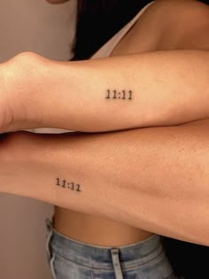 two women with tattoos on their arms and one has the number 11 in it's left