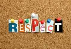 the word respect written in cut out letters on a cork notice board