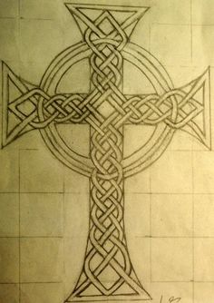 a drawing of a celtic cross on paper