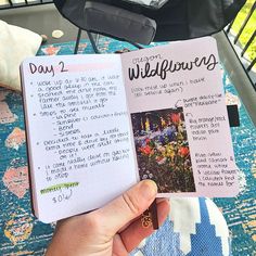 a person holding up a book in their hand with an open page on the inside