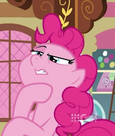 the pinkie is looking at something in front of her face and she's frowning