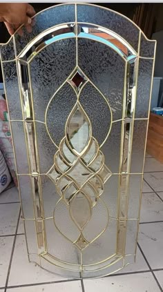 a decorative glass door with an intricate design