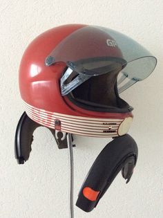 a helmet mounted to the side of a wall