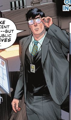 a man in a suit is talking on the phone