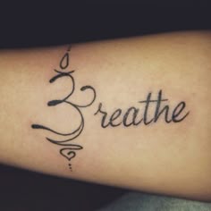 a tattoo with the word breathe on it