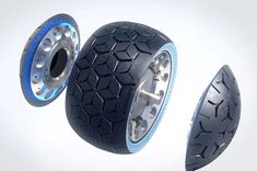 three different types of wheels and tires on a white background with blue lights in the middle