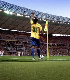 a soccer player raising his arm in the air