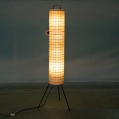a lamp that is on top of a stand