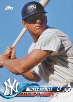 a baseball player holding a bat on top of a blue and white cover with the new york yankees logo