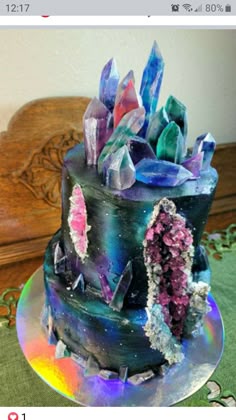 a cake with crystals on it sitting on a table