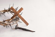 a crown of thorns with a wooden cross on top