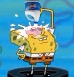 an animated spongebob character splashing water on his face