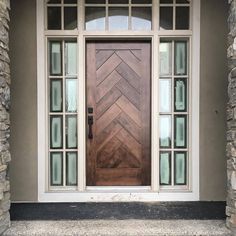 a wooden door sitting inside of a stone building