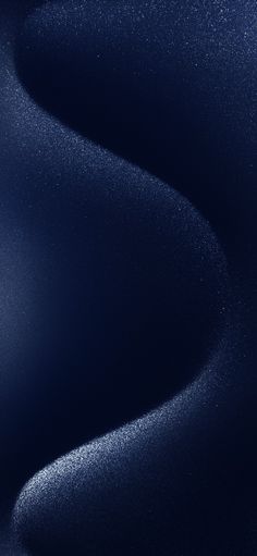 an abstract blue background with small white dots on the top and bottom half of it