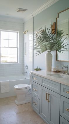 a bathroom with a toilet, sink, and bathtub in the middle of it