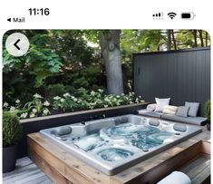 a hot tub sitting on top of a wooden deck
