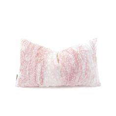 a pink and white pillow on a white background